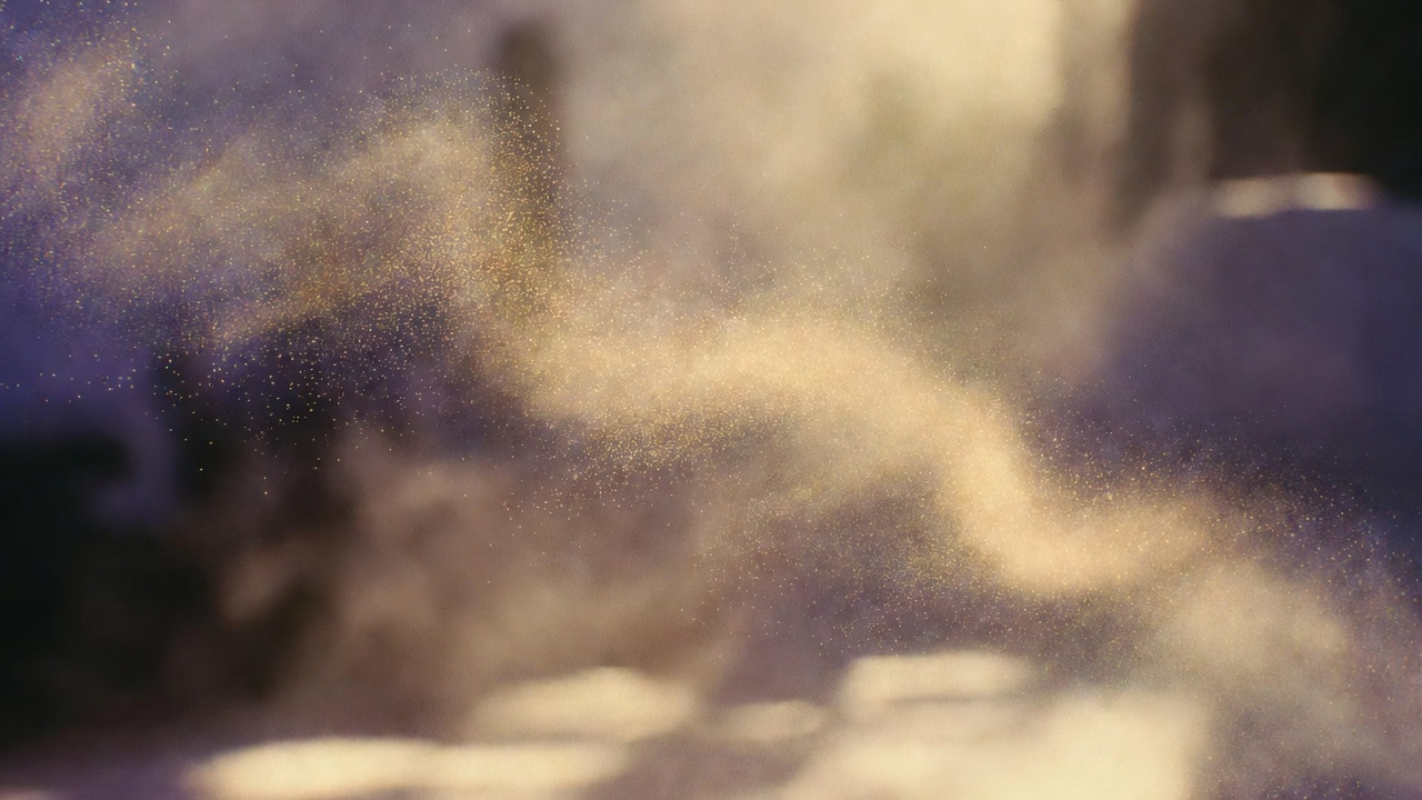 Abstract golden particles suspended in air, diffusing like silk in a calm, dimly lit atmosphere, suggesting an unseen presence being carried
